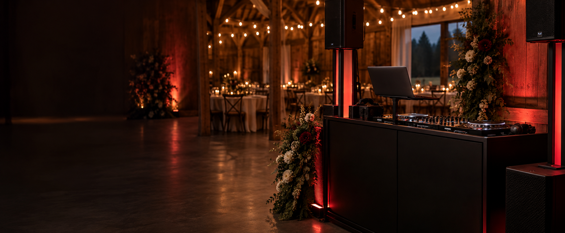 Illustration of a DJ booth in a warmly lit barn reception setting